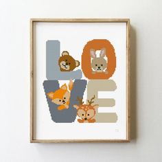 a cross stitch pattern with animals and letters that spell out the word love on it