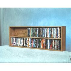 a wooden book shelf filled with lots of books