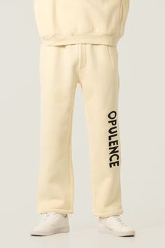 These sweatpants feature a classic fleece fabric trimmed with durable beige jacquard elastic and metal drawstring tips. The pants have 2 side pockets and a comfortable relaxed fit. Male Model is 6'1 wearing a XL (SIZE UP FOR BEST FIT) Cream Sweatpants, Bungee Cord, Fabric Trim, Embroidered Design, Fleece Fabric, Male Model, Sweatpants, Relaxed Fit, Elastic