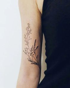 a woman with a tattoo on her arm