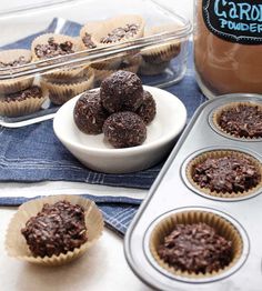 chocolate cupcakes in muffin tins next to a container of caramel fudge