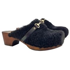 Wonderful and very comfortable clogs, revisited in a winter version. The foot is wrapped, kept warm and in full comfort by a soft synthetic fur, the design is the classic one of the iconic closed leather sandal, to wear it at any temperature. Women's clogs with brown wood effect base Upper in black synthetic fur, with golden accessory Heel height 5 cm + plateau 2 cm Made entirely by specialized Italian personnel Handcrafted products using the best materials. BEFORE PURCHASING DO NOT FORGET TO CH Luxury Black Clogs With Leather Sole, Winter Slip-on Clogs With Faux Fur Lining, Black High Heels Clogs & Mules, Black Platform Heels Clogs & Mules, Comfortable Slip-on Clogs With Faux Fur Lining, Dutch Clogs, Women's Clogs, Womens Clogs, Brown Wood