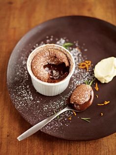 a chocolate dessert with ice cream and sprinkles on a plate