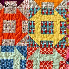 a close up view of a colorful quilt