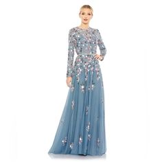 Mac Duggal Hand-Embellished Embroidered Overlay; 100% Polyester Lining Fully Lined Through Bodice And Skirt; Sheer Unlined Sleeves High Neckline Long Sleeves Beaded Waist Detail Floral Embroidery Accented By Hand-Stitched Sequins A-Line Silhouette Concealed Back Zipper Approx. 62.5" From Top Of Shoulder To Bottom Hem Available In Slate Blue Style #5721 Questions? Leave A Comment Below! Blue Embellished Evening Dress For Reception, Embellished Blue Evening Dress For Reception, Elegant Light Blue Gown For Reception, Elegant Light Blue Dress For Reception, High Neck Gown, Mac Duggal Dresses, Wedding Guest Looks, Mac Duggal, Blue Style