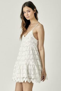 STYLE INFORMATION: Make any occasion special in the Davina White Crochet Mini Dress! Wave crochet knit shapes this casual dress that has adjustable straps, a V-neckline, and a fitted bodice. An empire waist tops a twirly mini skirt with a ruffled scalloped hem. Lined DETAILS & CARE: 100% Polyester. Rayon Lining. Machine wash cold. Imported. SHIPPING: We offer free shipping over $100 for all orders in the Continental US. Chic V-neck Crochet Dress For Day Out, Casual Crochet Dress With Spaghetti Straps For Spring, Casual V-neck Crochet Dress For Day Out, Summer V-neck Crochet Dress For Brunch, Summer Crochet V-neck Dress For Brunch, Chic Crochet Lace Dress With Spaghetti Straps, Spring Chic Mini Crochet Dress, Spring Crochet Sundress With Spaghetti Straps, V-neck Crochet Dress For Day Out