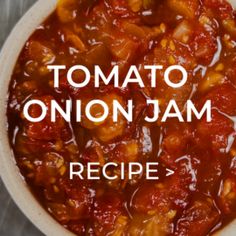 tomato onion jam recipe in a white bowl with the words tomato onion jam on it