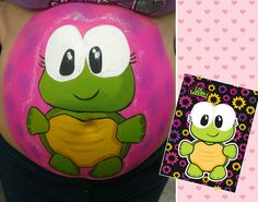 a pregnant woman with her belly painted like a turtle and the image of a baby turtle