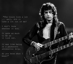 a man with long hair holding a guitar in front of a quote from the rolling stones