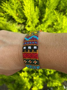 Colourful Seed Loom Beaded Ethnic Bracelet, Bead Cuff Bracelet, Seed Bead Woven Bracelet, Mexican Bracelet, Huichol Bracelet, Gift for Her One of a kind colorful bracelet having geometric native american patterns is a unique gift and suitable for your casual wear. This chic bracelet is made with a bead loom weaving technique using different colors glass seed beads and nylon beading thread. The bracelet is closed with beadwoven  button closure.  Measurements : Length : 17.5cm Width : 2.5cm Shippi Huichol Bracelet, Bead Cuff Bracelet, Bracelet Mexican, Bead Woven Bracelet, Native American Patterns, Colorful Bracelet, Beading Thread, Chic Bracelet, Bracelet Bead