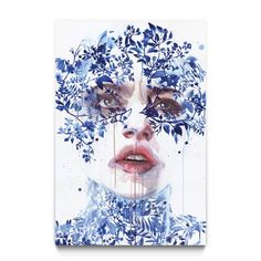 a woman's face is covered in blue leaves and dripping water from her eyes