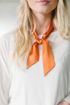 "Give your look an instant style upgrade with this classic silk skinny scarf. Wear knotted around your neck or styled as a choker, adorn your hair and wear as a turban/headband, wrap it around your wrist for arm candy or use it as an accent for your handbag. Color: Dark Orange* 100% Silk charmeuse 2\" wide x 36\" long Hand wash, lay flat to dry *Also available in: Black, Grey, Taupe, Ivory, Wine, Royal Blue, Olive Green, Mauve" Fred Jones Costume, Orange Scarf Outfit, Neck Tie Outfit, Scarf Hairstyles Short, Silk Scarf Outfit, Cute Couples Costumes, September Fashion, Headband Scarf, Neck Scarf Tying