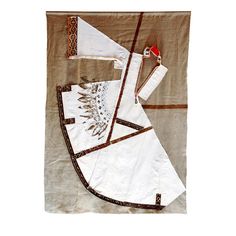 two pieces of white cloth with brown trims on top of each other, one folded and the other unzipped