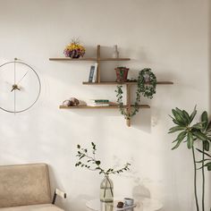 a living room filled with furniture and shelves next to a wall mounted clock on the wall