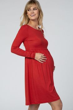 A comfortable u0026 casual maternity dress perfect for any day! A solid hued maternity dress featuring long sleeves, a rounded neckline, and a pleated cinched elastic waistline. The Rust Long Sleeve Pleated Maternity Dress is perfectly bump-friendly! Casual Maternity Dress, Casual Maternity, Pink Blush Maternity, Maternity Dress, Maternity Dresses, Pleated Dress, Maternity Clothes, Fitness Models, Rust