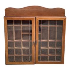 a wooden cabinet with glass doors on the front and side panels in different shapes, sizes and colors