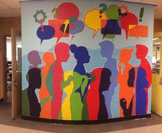 a colorful mural on the side of a round wall in an office building with people talking to each other