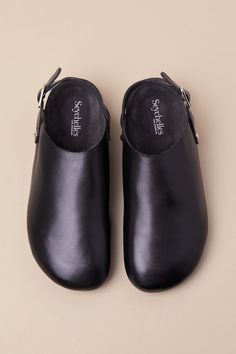 The sleekest and chicest everyday looks always include the Seychelles Buckle Up Black Leather Slingback Slip-On Clogs! Smooth genuine leather shapes a clog-inspired upper with a rounded toe and a slingback-style strap with an adjustable silver buckle and matching studs at the instep and outstep. The slip-on design makes for effortless styling, while a contoured, suede leather insole makes for a comfortable wear! 1" Heel. Smooth insole. Rubber sole has nonskid markings. Genuine leather upper, bal Modern Clogs With Rubber Sole And Open Heel, Modern Open Heel Clogs With Rubber Sole, Leather Slingback Mules With Rubber Sole, Leather Slingback Clogs With Rubber Sole, Leather Slingback Clogs With Heel Loop, Modern Slip-on Clogs With Buckle Closure, Modern Closed Toe Clogs With Buckle Closure, Classic Black Slingback Mules, Elegant Leather Clogs With Leather Footbed