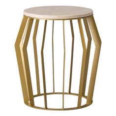 a gold side table with a marble top and geometric design on the bottom, against a white background