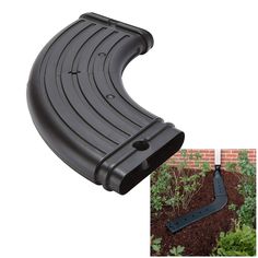 an image of a black plastic garden edging device on top of dirt and plants