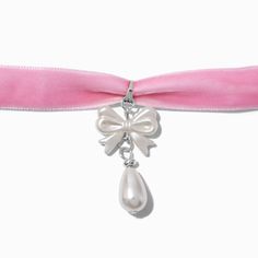 Add a pop of pink with this choker necklace. The silver-tone design has a bow pendant and a faux pearl teardrop detail. Finish: Silver-toneLength: 11.5 in. / 29.2 cm. Closure: Lobster claspMaterial: Metal - Claire's Pink Velvet Pearl Bow Pendant Choker Necklace Cute White Jewelry With Ribbon, Cute Adjustable Ribbon Jewelry, Adjustable Ribbon Jewelry For Valentine's Day, Coquette Diy, Coquette Jewelry, Crown Hair Clip, Disney Zombies, Sensitive Ears Earrings, Bow Choker