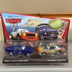 two toy cars are shown in the box