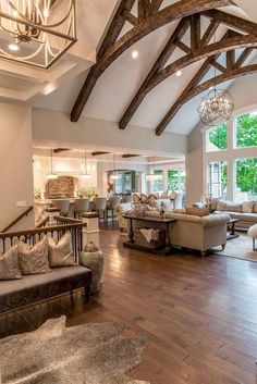 a living room filled with furniture and lots of windows