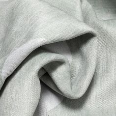 a close up view of the fabric on a white shirting material that is very soft