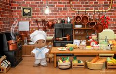 a doll is standing in front of a table full of food and cooking utensils