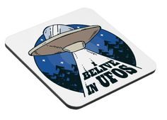 a coaster with an alien flying through the sky and words believe in ufos on it