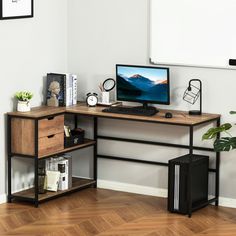 a desk with a computer on top of it