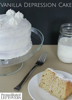 a piece of cake sitting on top of a white plate next to a glass jar