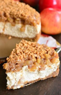 two pieces of cake sitting on top of a wooden table next to an apple pie