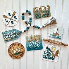 some magnets that are on the side of a white wall with blue and brown accents