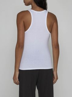 Filippa K's white ribbed knit stretch cotton tank top featuring a round neckline, racer-style and fitted silhouette. Composition: 95% cotton 5% elastane White Seamless Everyday Tank Top, White Seamless Tank Top For Everyday, White Seamless Crew Neck Tank Top, White Stretch Tops With Tank Straps, Everyday White Ribbed Tank Top, Fitted White Cami Tank Top, White Fitted Cami Tank Top, Fitted White Camisole For Everyday Wear, White Fitted Camisole For Everyday