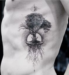 a man's chest with a tree and moon tattoo on the side, as well as roots