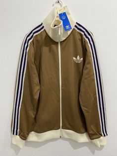 Adidas Originals Adicolor Heritage Track Top Jacket Brown Desert Size 2XL | eBay Fitted Sportswear Outerwear With Ribbed Cuffs, Sporty Cotton Track Jacket With Long Sleeves, Sporty Fall Track Jacket With Funnel Neck, Sporty Funnel Neck Track Jacket For Fall, Fall Sportswear Track Jacket With Long Sleeves, Sporty Winter Track Jacket With Funnel Neck, Winter Sporty Track Jacket With Funnel Neck, Winter Track Jacket With Zipper And Stand Collar, Sporty Half-zip Outerwear With Ribbed Cuffs