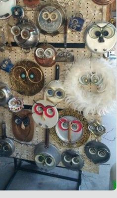 there are many different items on the pegs in this room, including masks and eyeballs