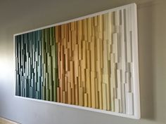 an abstract painting on the wall in a room