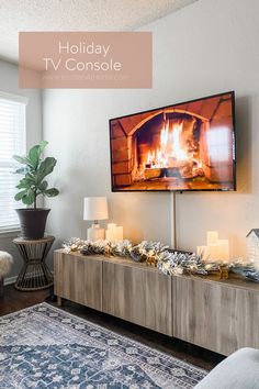 a living room filled with furniture and a flat screen tv mounted above it's fireplace