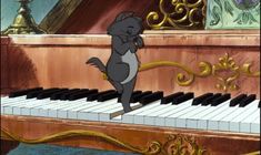 a cartoon cat standing on the keys of a piano and looking at something in front of him