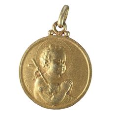 A French 18 karat (18K) yellow gold charm pendant designed as a medal depicting the Jesus Child holding the Lamb of God and a shepherd's crook while praying. The reverse shows the top of a column with roses surmounting it. Signed Becker and stamped with the eagle's head for 18 karat gold and French manufacture and an unknown maker's mark.  Dimensions: 2.3 x 1.9 x 0.13 cm (not including jump ring) Weight: 3.09 grams (Chain not included) The Lamb Of God, Jesus Necklace, Lamb Of God, Gold Heart Locket, Lucky Horseshoe, Locket Charms, Gold Medal, God Jesus, Heart Locket