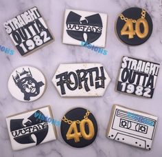 nine decorated cookies with the names of various countries and numbers on them, all in black and white