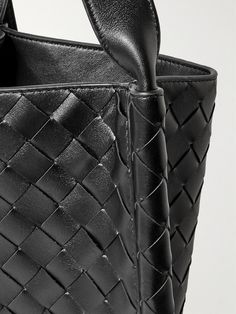 "When creating a Bottega Veneta bag, we count days, not hours, " says the brand. Artisans in Italy have handcrafted this messenger bag by meticulously weaving strips of leather in the signature intrecciato technique. It's roomy enough to carry your tablet, water bottle and a hard case for your sunglasses. Luxury Satchel With Braided Handles, Classic Woven Leather Bag With Double Handle, Classic Woven Leather Tote Bag, Luxury Tote Shoulder Bag With Braided Handles, Designer Woven Leather Satchel Bag, Designer Woven Leather Satchel, Business Intrecciato Weave Crossbody Bag, Designer Leather Shoulder Bag With Intrecciato Weave, Luxury Rectangular Shoulder Bag With Woven Leather