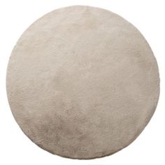 the round rug is made from white wool and has been placed in front of a white background