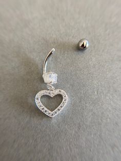 Sterling Silver CZ Heart Belly Button Rings, Navel Piercing,Belly Barbell, Belly Button Jewelry, Belly Piercing - Sterling Silver Color : Silver Material : CZ Heart - Sterling Silver / Barbell - Surgical Steel CZ Heart Size : 14mm / Barbell Size : 15mm /Ball Size : 4mm Gauge: 14 Gauge (Approx 1.6 mm) * Metal components are Sterling Silver. * Suitable for delicate and sensitive skin. * Comes in a jewelry box. If you need extra boxes for gifting....just let us know! Elegant Silver Heart Piercings, Silver Heart Belly Rings For Valentine's Day, Silver Heart Piercings For Valentine's Day, Valentine's Day Silver Heart Belly Rings, Adjustable Silver Heart Piercings, Belly Button Jewelry, Navel Piercing, Button Rings, Belly Piercing