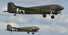 two planes flying in the sky with clouds behind them