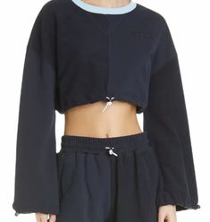 The Bungee Sweatshirt Features A Cropped Silhouette With Long Bell Sleeves & Elastic Drawstring Cords At The Waist & Sleeve Lines. This Style Is Constructed Out Of Contrasting French Terry And Jersey Fabrics And Pairs Well With Any Of Our Coordinating Shorts Or Sweatpants. Short And Sporty, This Sweatshirt Is Cinched With A Bungee Cord At The Cropped Waist And Long Sleeves To Adjust The Fit From Loose To Bloused. Measurements (Flat Lay) Length 16" Sleeve Length 20" Chest (Pit To Pit) 22" Long Bell Sleeves, Cardigan Oversized, Rib Knit Cardigan, Belted Cardigan, Color Block Cardigan, Bungee Cord, Ribbed Cardigan, V Neck Cardigan, Knit Sweatshirt