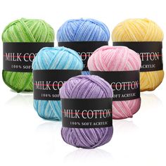 six balls of milk cotton yarn in various colors