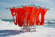 an orange display stands out in the snow